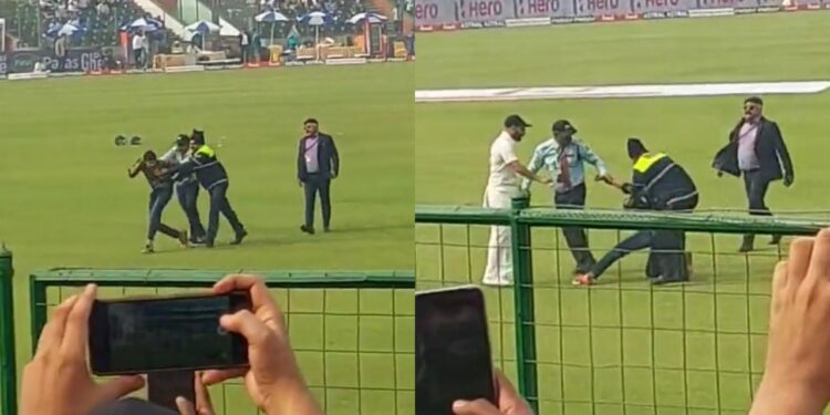 Mohammed Shami comes to protect a pitch invader after security personnel slaps him